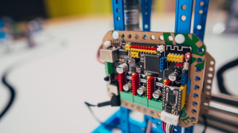 Electronic circuit board with processor and wires, close view